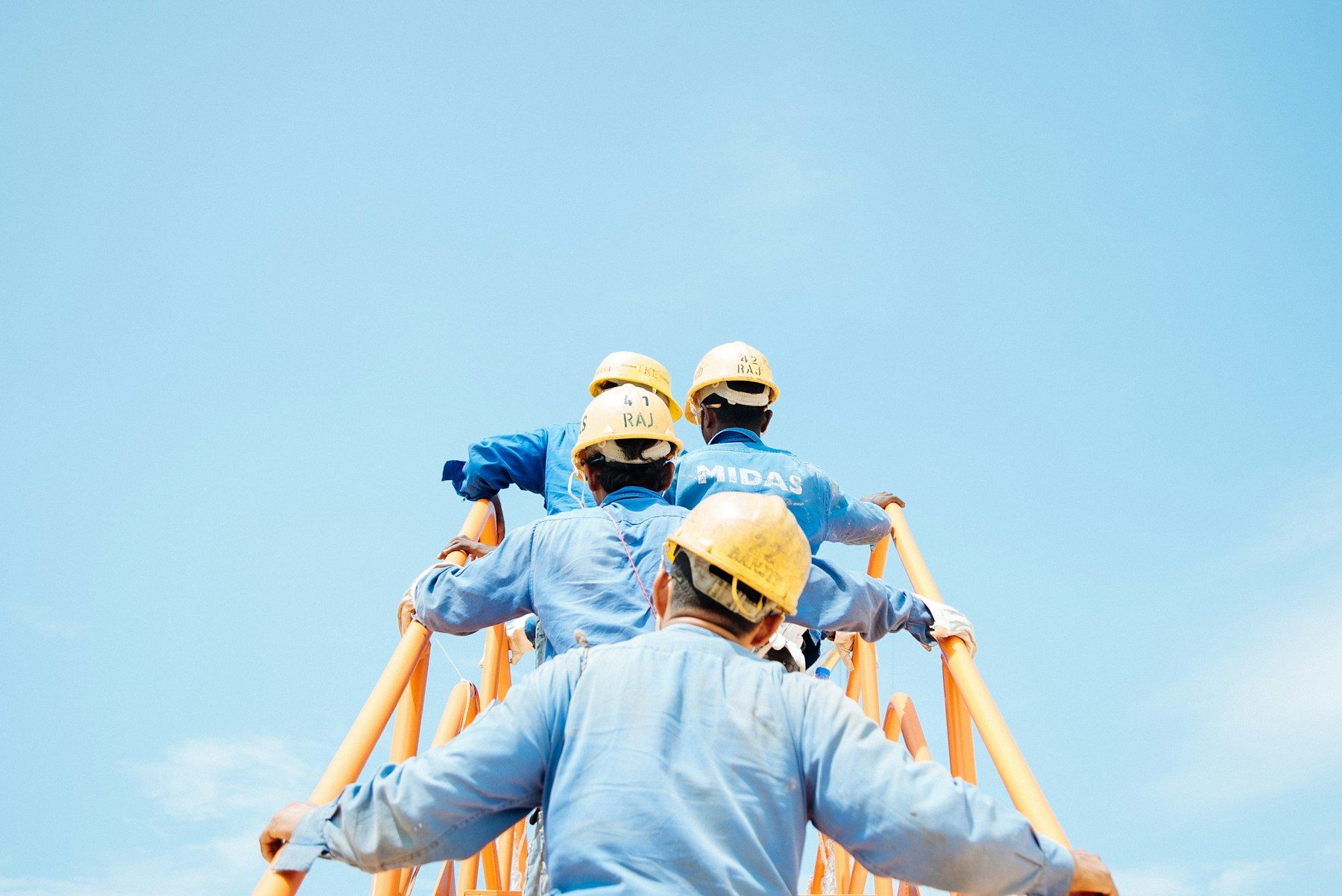 Maintenance crew climbing tower structure